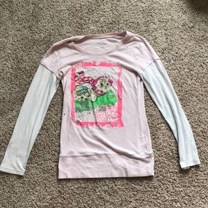 pink and white cat sledding shirt